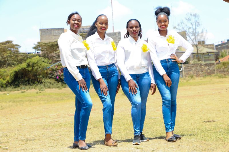 Team in casual white and yellow uniforms